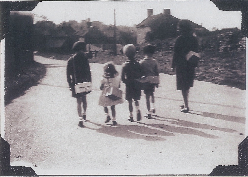 Evacuees Pictures from Winifred Leaning Gas Masks on Finkle Street