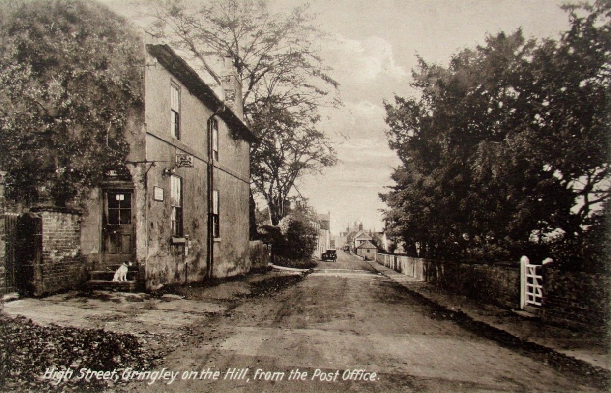 Beeches Post Office with dog and High Street looking west